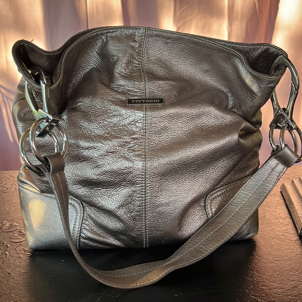 Vittorio Silver leather shoulder bag with chunky silver hardware.